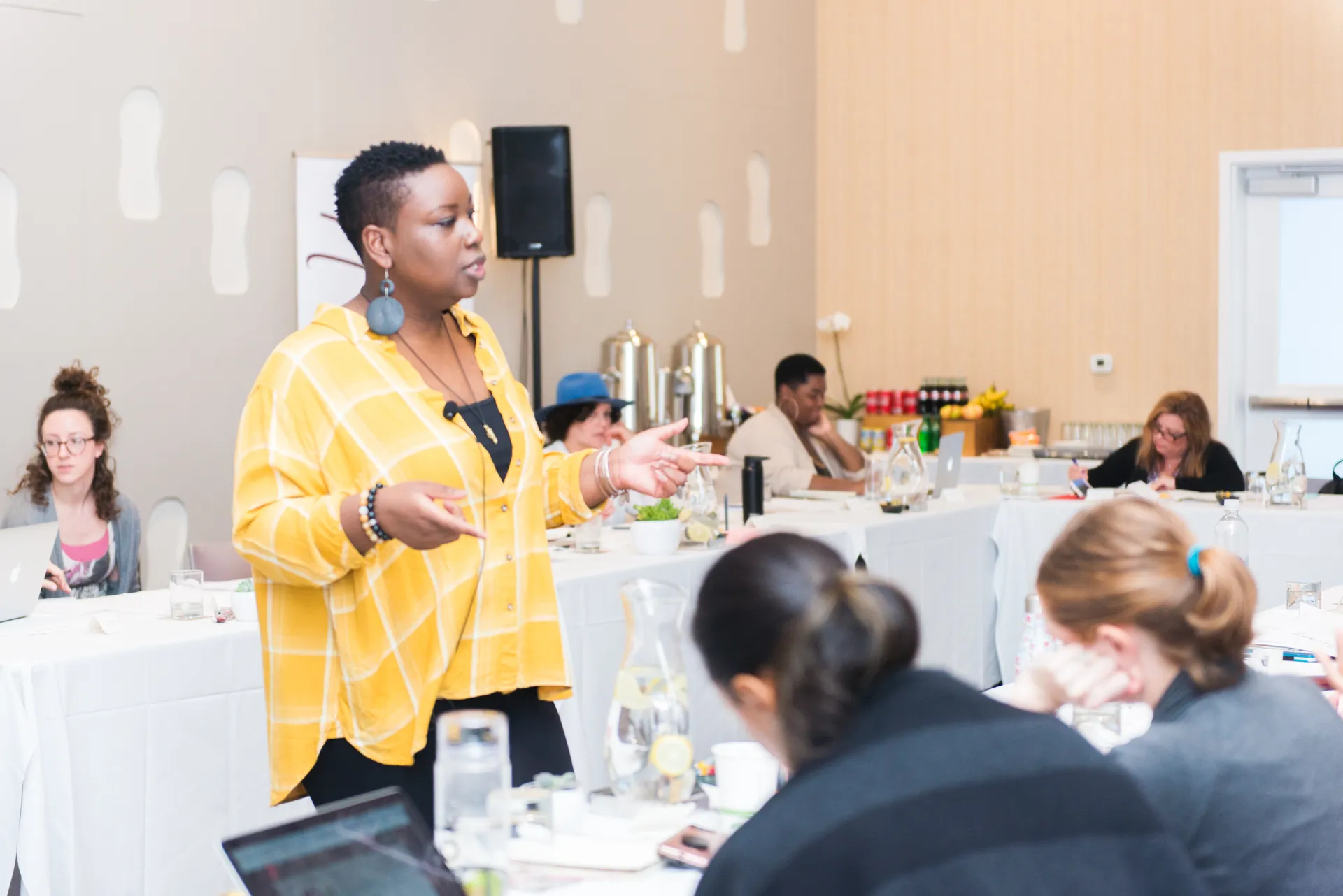 Kali Shelton teaching a group of leaders at a retreat workshop